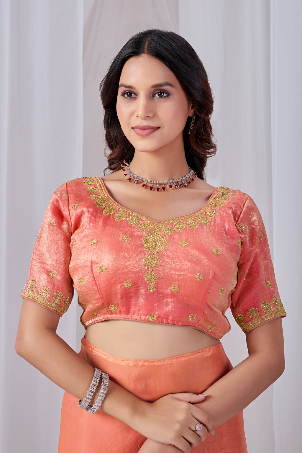 Luminous Peach Tissue Silk Saree with Embroidered Blouse