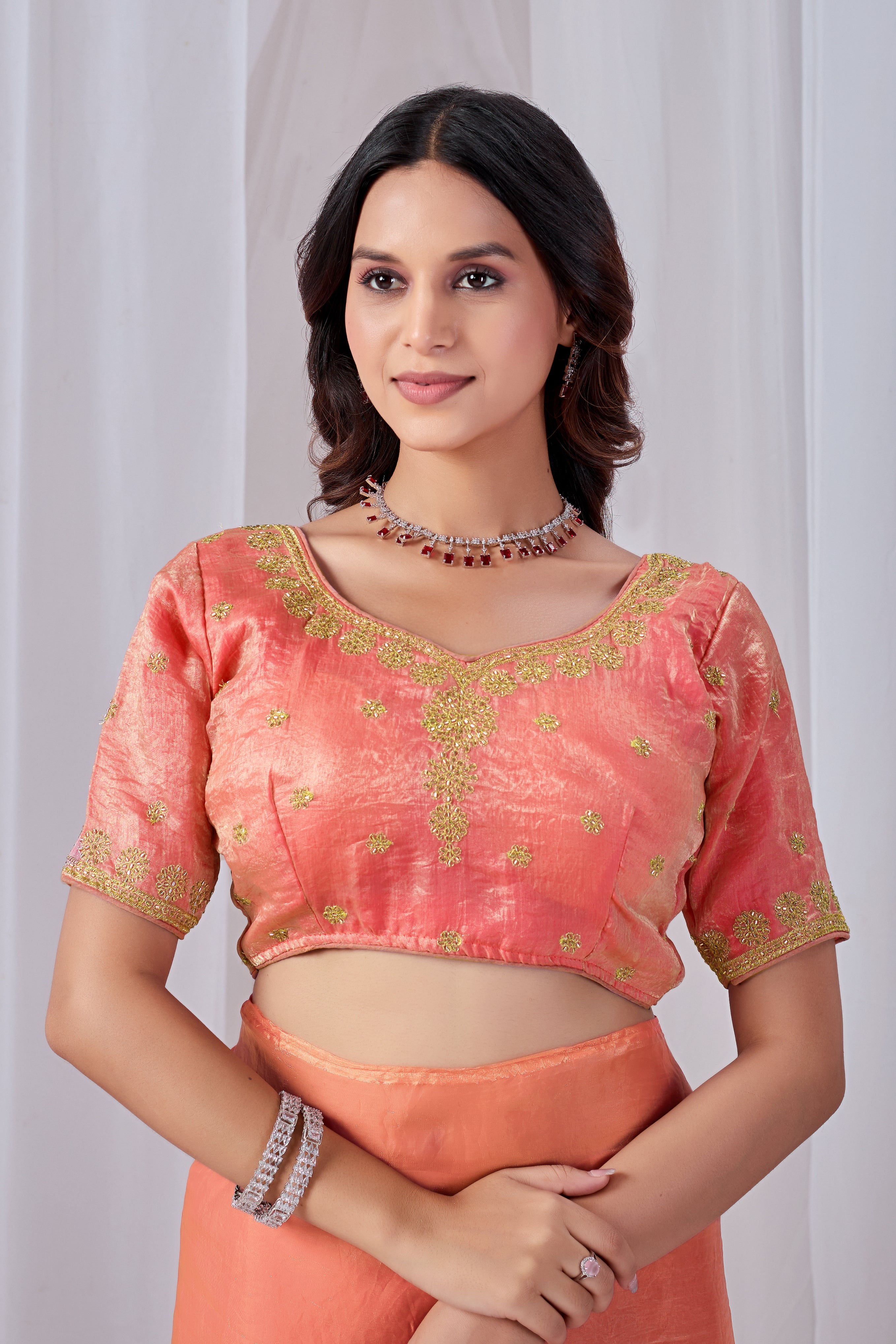 Luminous Peach Tissue Silk Saree with Embroidered Blouse