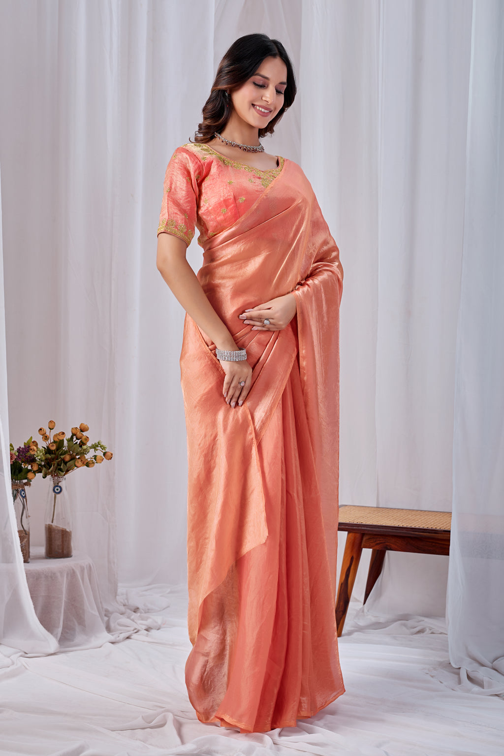 Luminous Peach Tissue Silk Saree with Embroidered Blouse