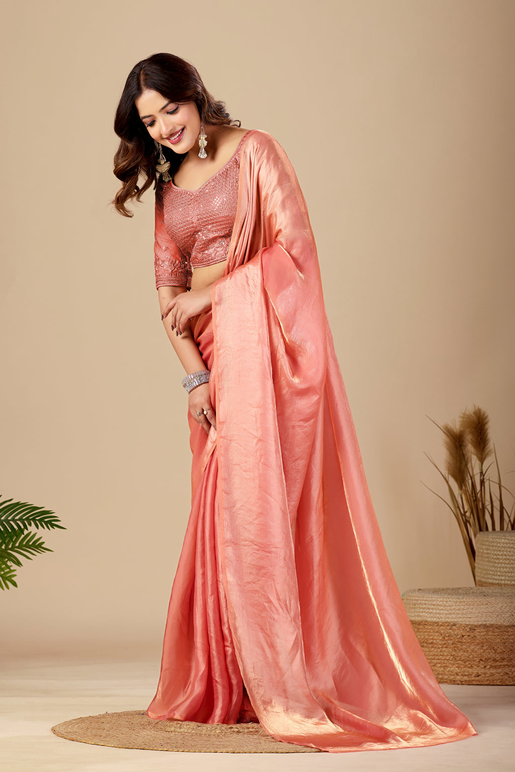 Shimmering Peach Tissue Silk Saree with Sequins Embroidered Blouse