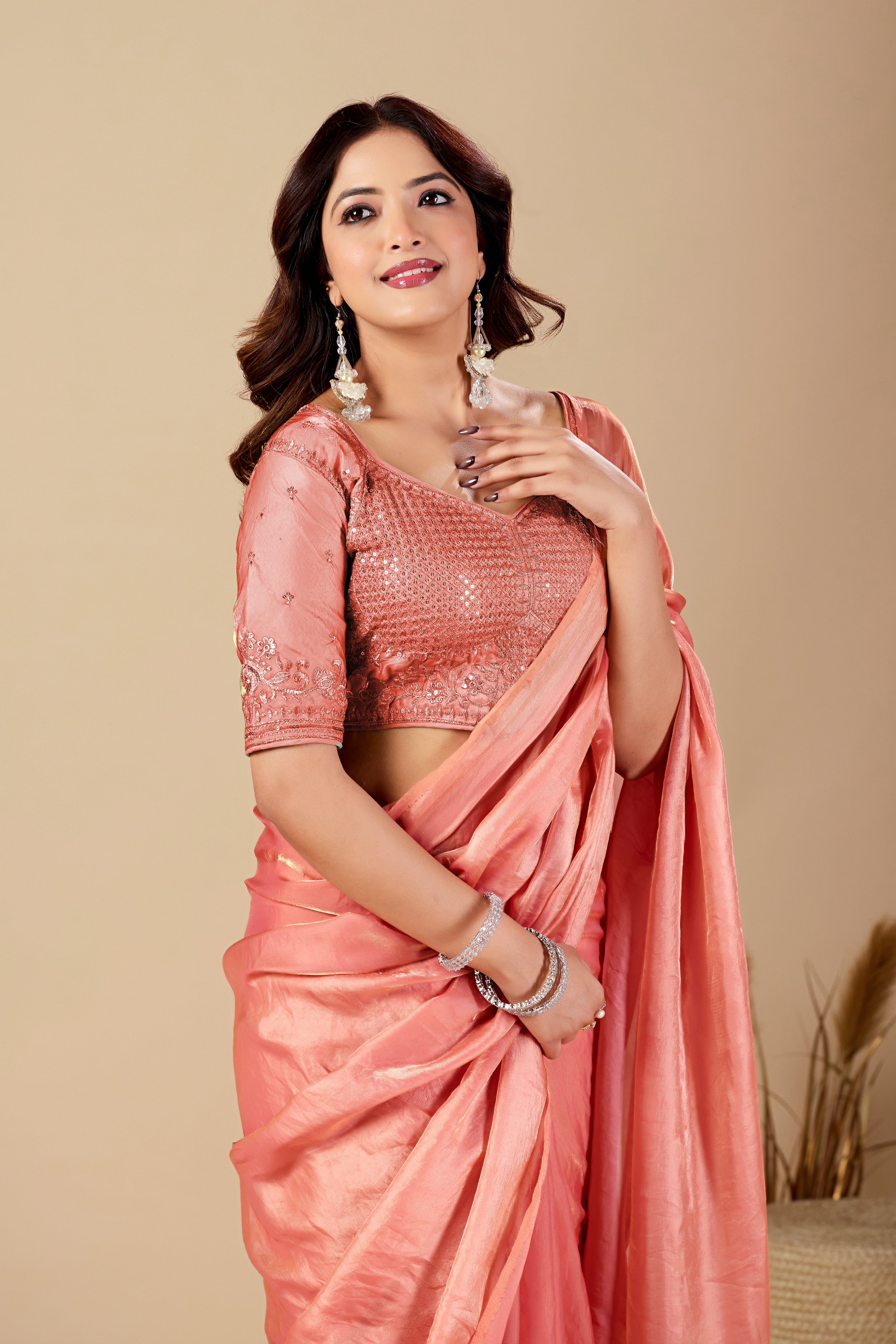Shimmering Peach Tissue Silk Saree with Sequins Embroidered Blouse